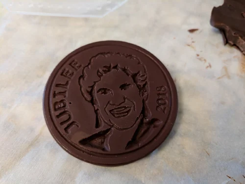 The tempered chocolate was poured into the vacuum formed molds. The result, a few small bubbles but overall a success.