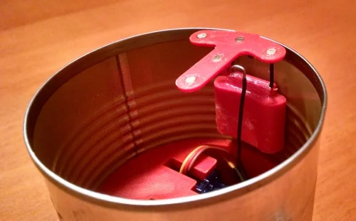 The electronics fit snugly inside the bottom of a standard 300 series can. Lid Hinge Lid Hinge