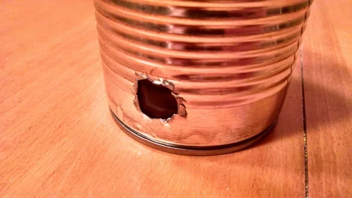 The lid hinge was 3D printed and attached to the can and lid with magnets for easy disassembly.   The hinge and actuator arm are black paperclips to reduce visibility. Button Button